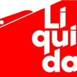 banner de divulgação da liquidação de verão da Lojas Torra. Está escrito Liquida sobre um fundo vermelho e há a imagem de uma tesoura com efeito de recortar o banner
